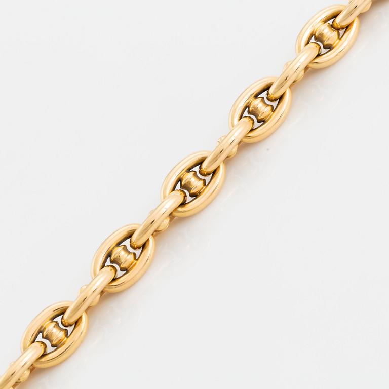 An 18K gold bracelet.