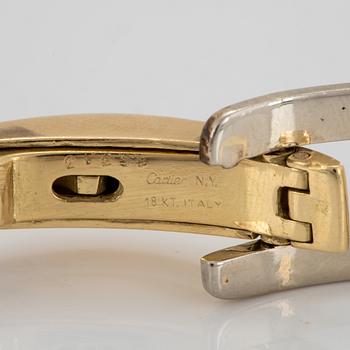 An 18K gold and white gold Cartier bracelet.