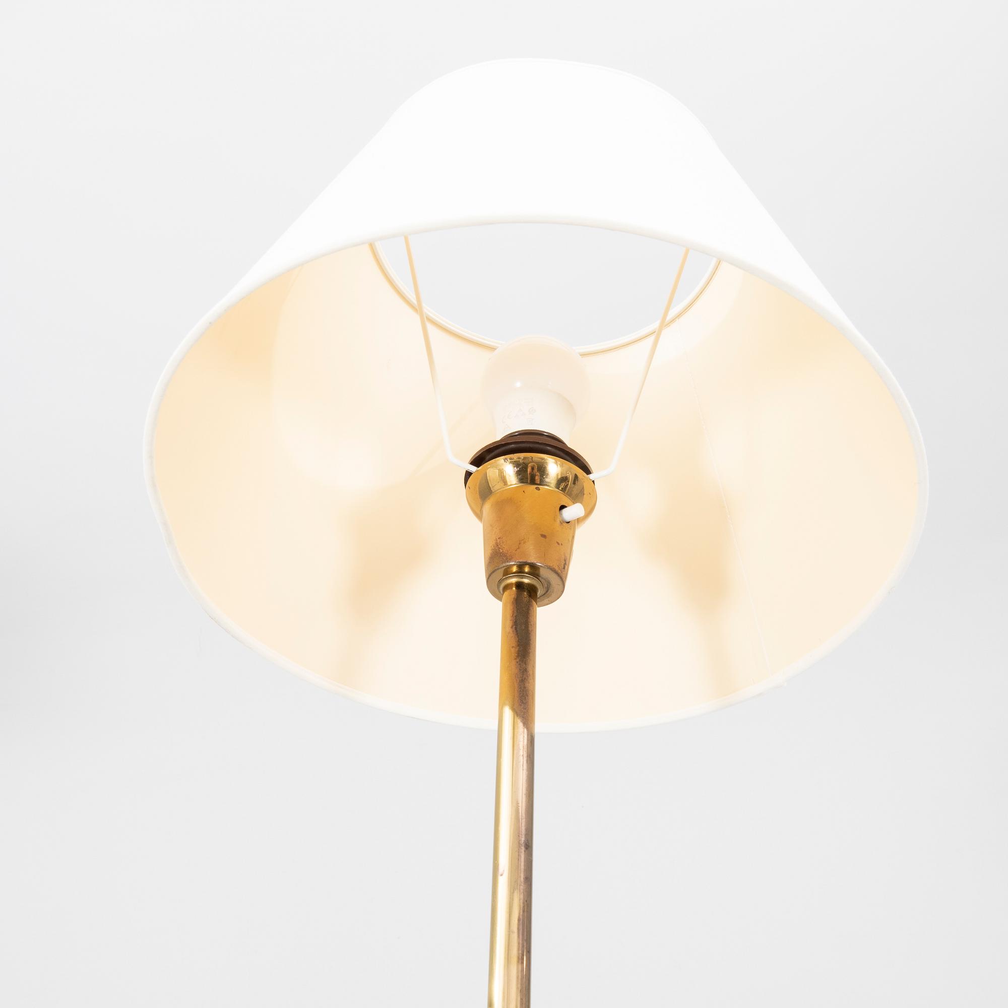 A pair of 1960s teak floor lamps.