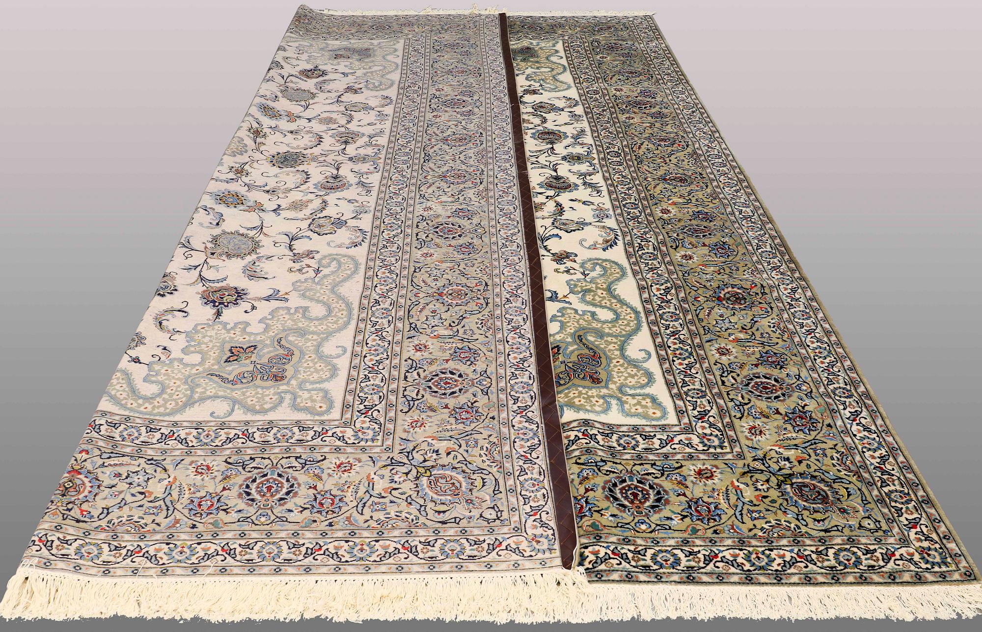 A signed so called Royal Kashan carpet, ca 432 x 313 cm.