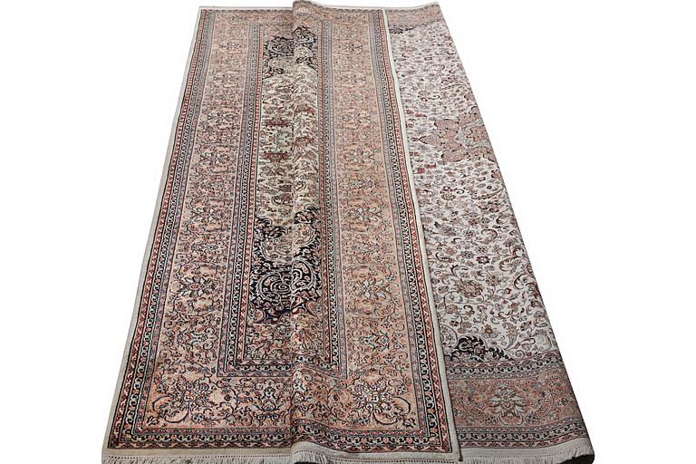 A carpet, silk Kashmir, c. 358 x 252 cm.