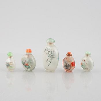 A group of nine Chinese glass and porcelain snuffbottles, 20th century.