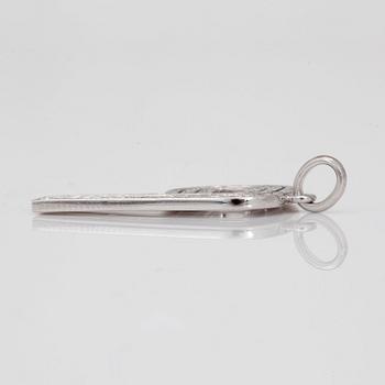 A Garrard and Co brilliant cut diamond pendant. Design by Jade Jagger. "The PI collection".