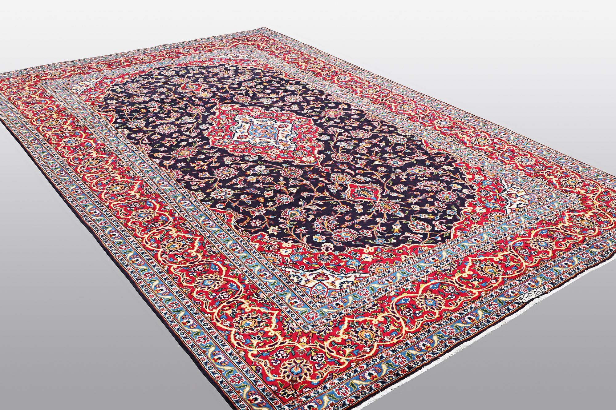 A carpet, Kashan signed Najafi, ca 360 x 231 cm.