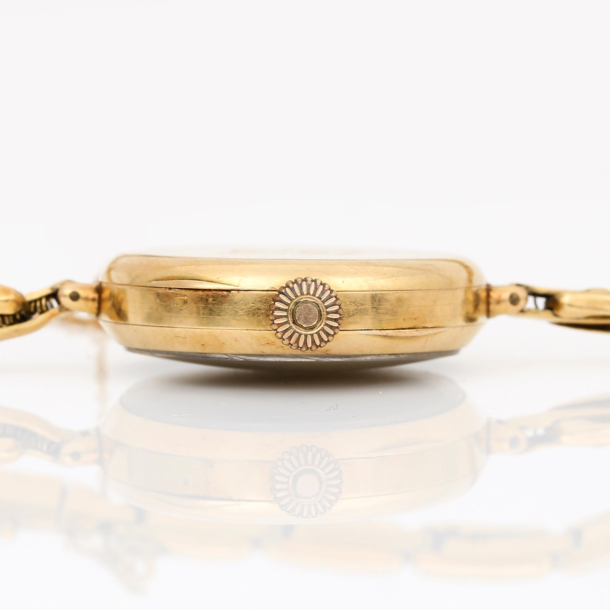 ARMBANDSUR, manuell, ur i 14K och länk i 18K guld, total vikt ca 19,8g.