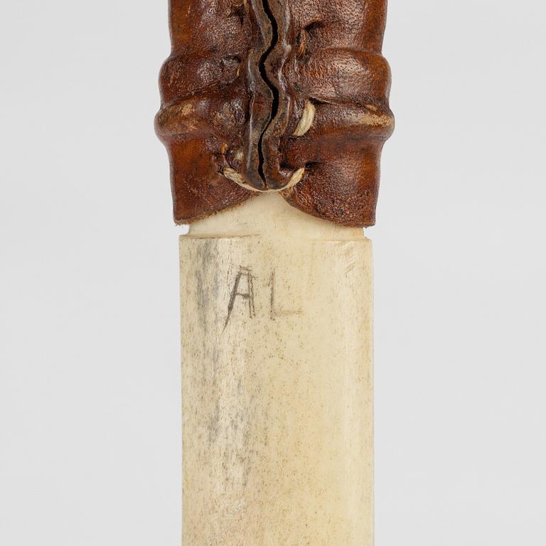 A reindeer horn knife, signed AL.