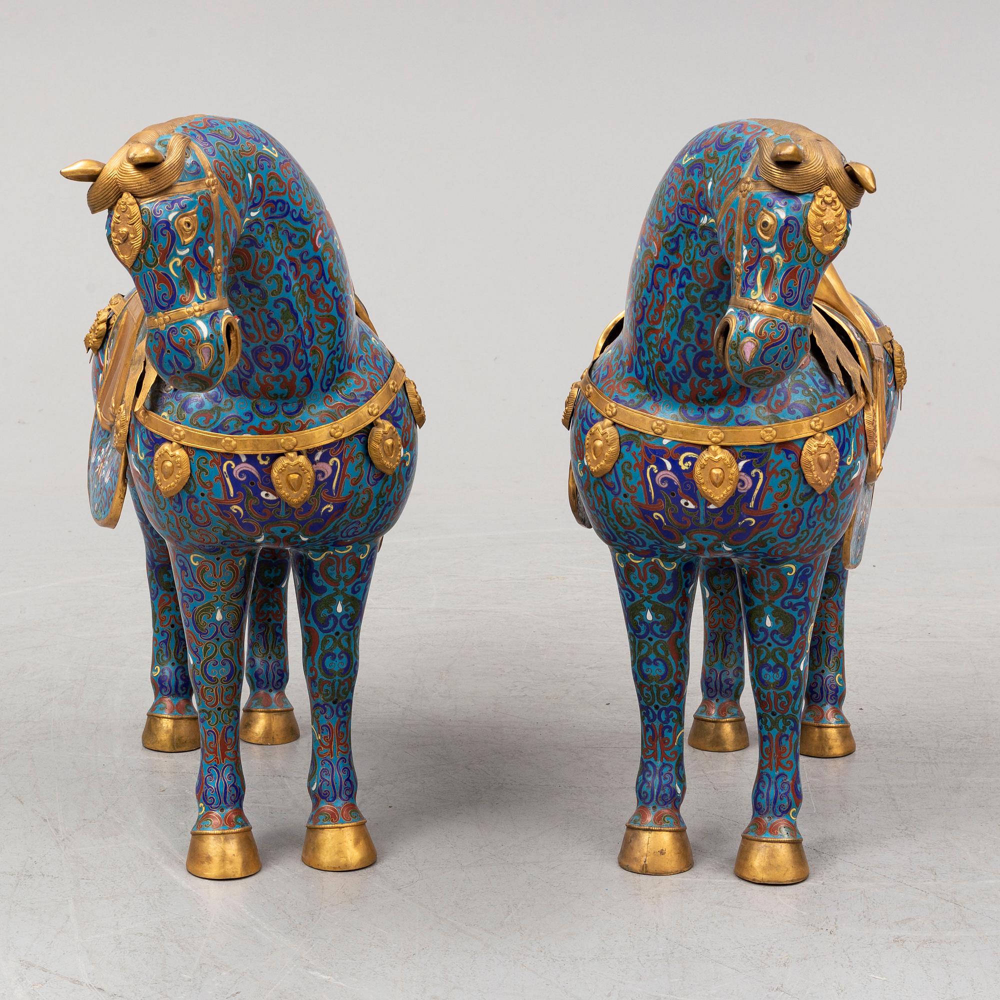 A pair of Chinese cloissoné horses, 20th Century.