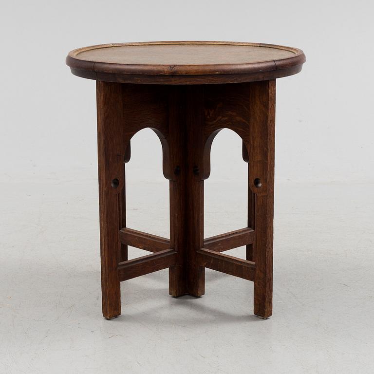 NORDISKA KOMPANIET, an Art Nouveau copper and oak smoking table, 1913.