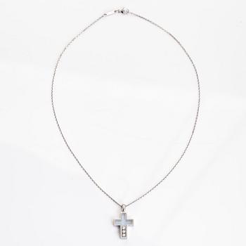 Chopard, an 18K whitegold 'Happy Diamonds" cross necklace set with diamonds.