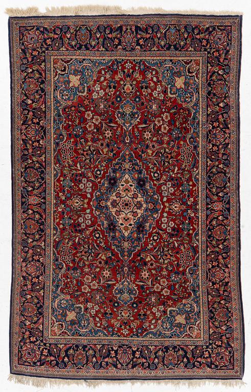 An Oriental rug, c. 195 x 132 cm.