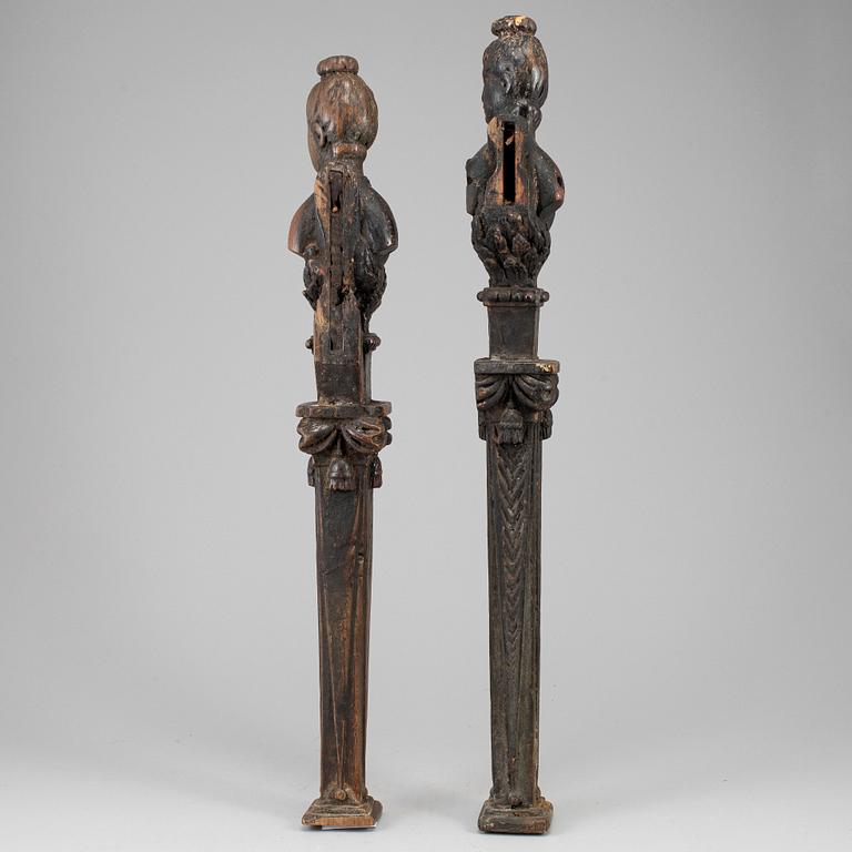 A pair of dark wood balusters, 18th century.