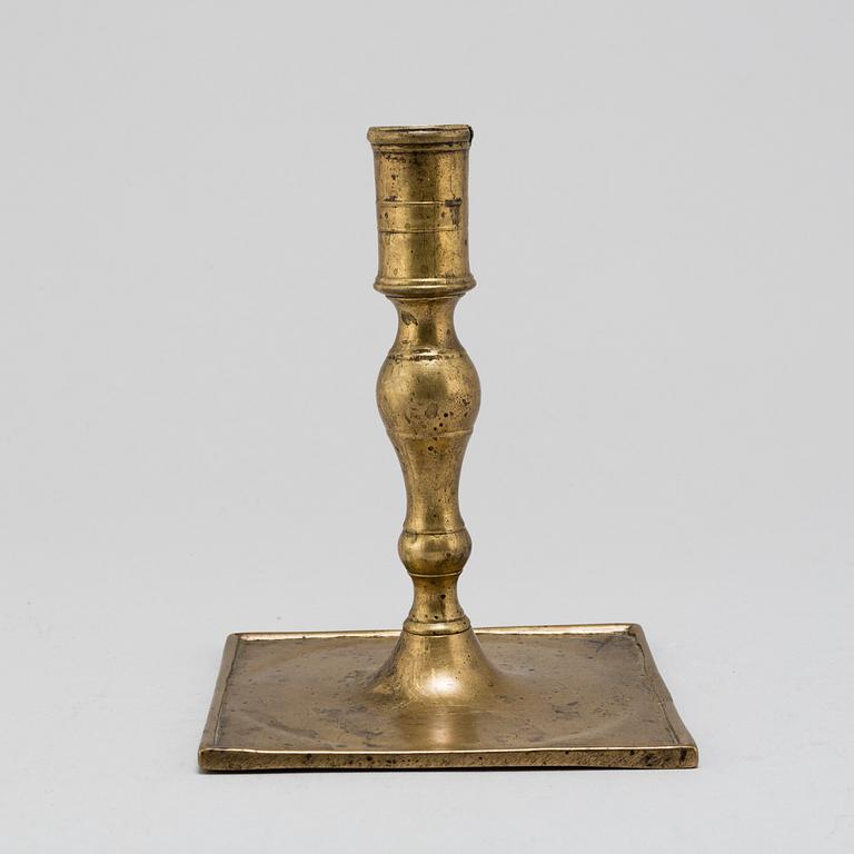 A Baroque brass candlestick, early 18th century.