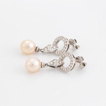 Pearl and brilliant cut diamond earrings.