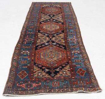 A Heris runner, antique, c. 325 x 88 cm.