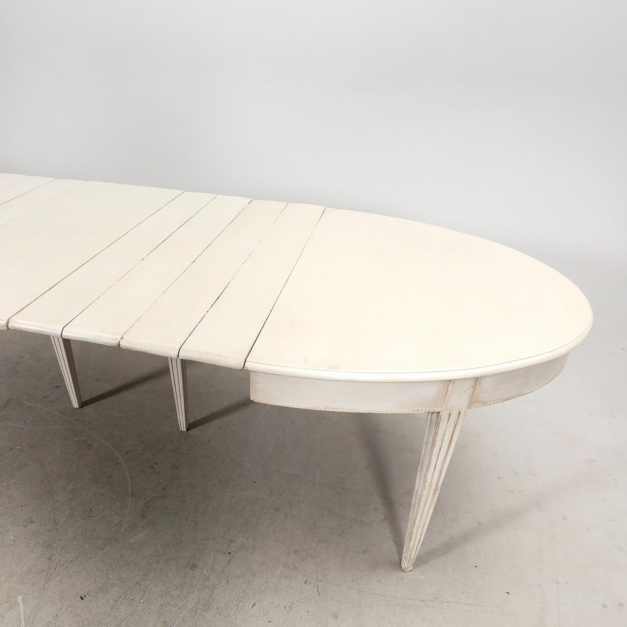 A painted 19th/20th Gustavian style dining table.