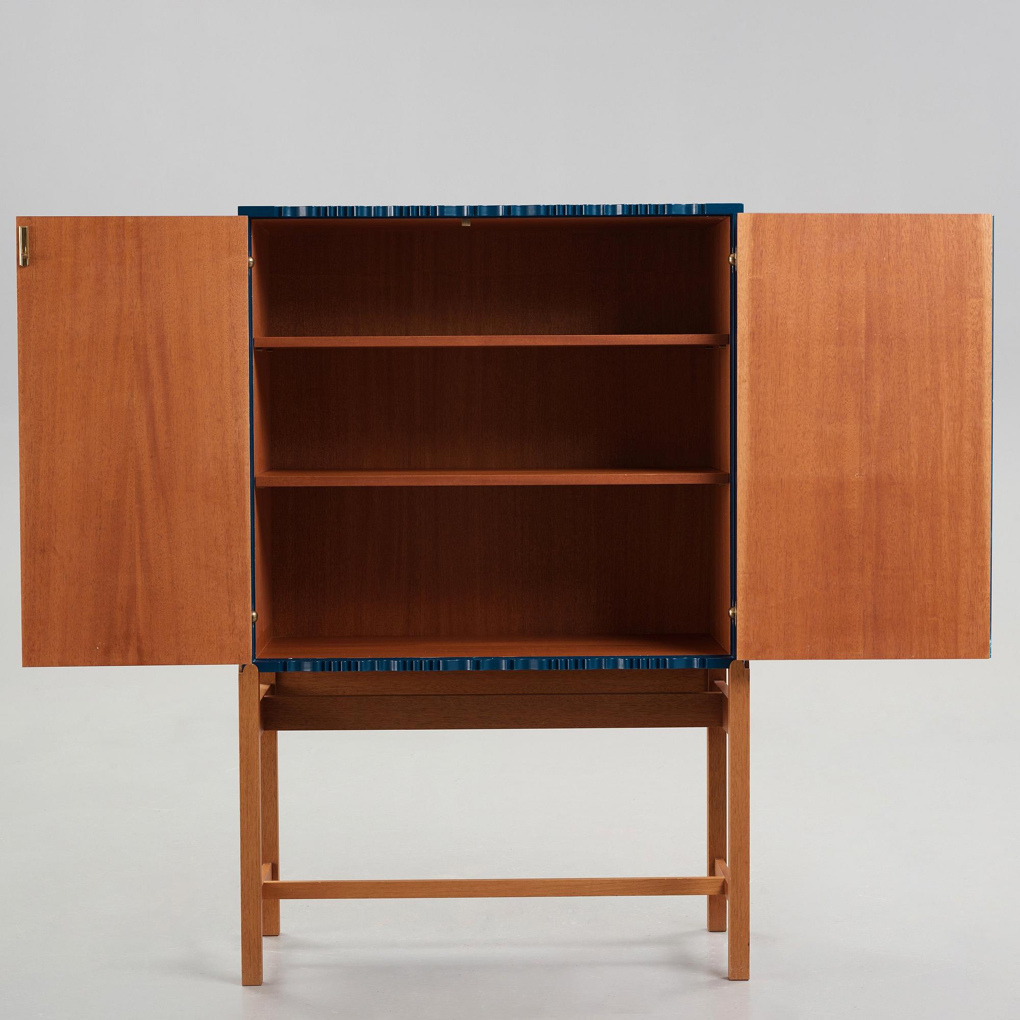 Josef Frank, a blue lacquered cabinet on stand, model nr 2192, by Svenskt Tenn, Sweden.