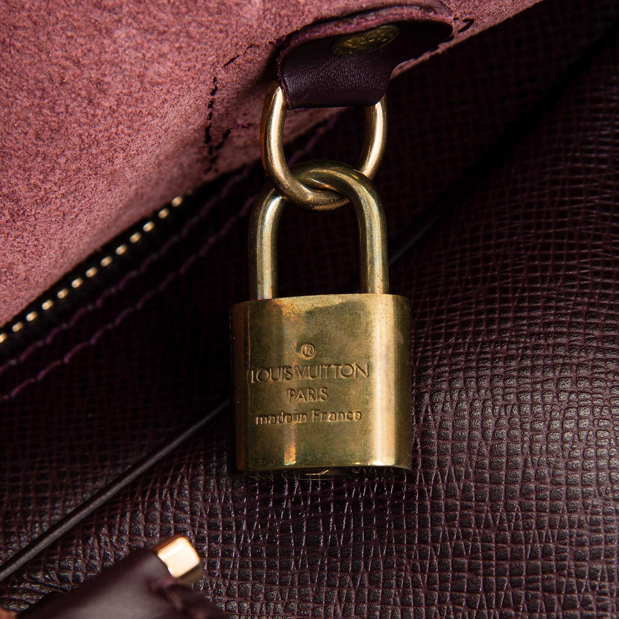 Louis Vuitton, a 'Taiga Kendall PM' weekend bag.