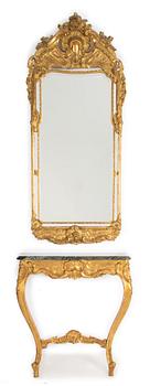 A Rococo style mirror and a console table, first half of the 20th Century.