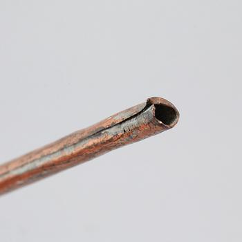 A 19th century pipette in copper.