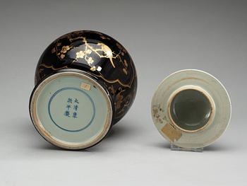 A black glazed jar with cover, Qing dynasty, 19th Century with Kangxi's six character mark.