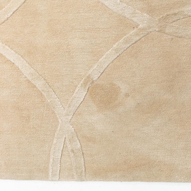 A carpet 360 x 360 cm.