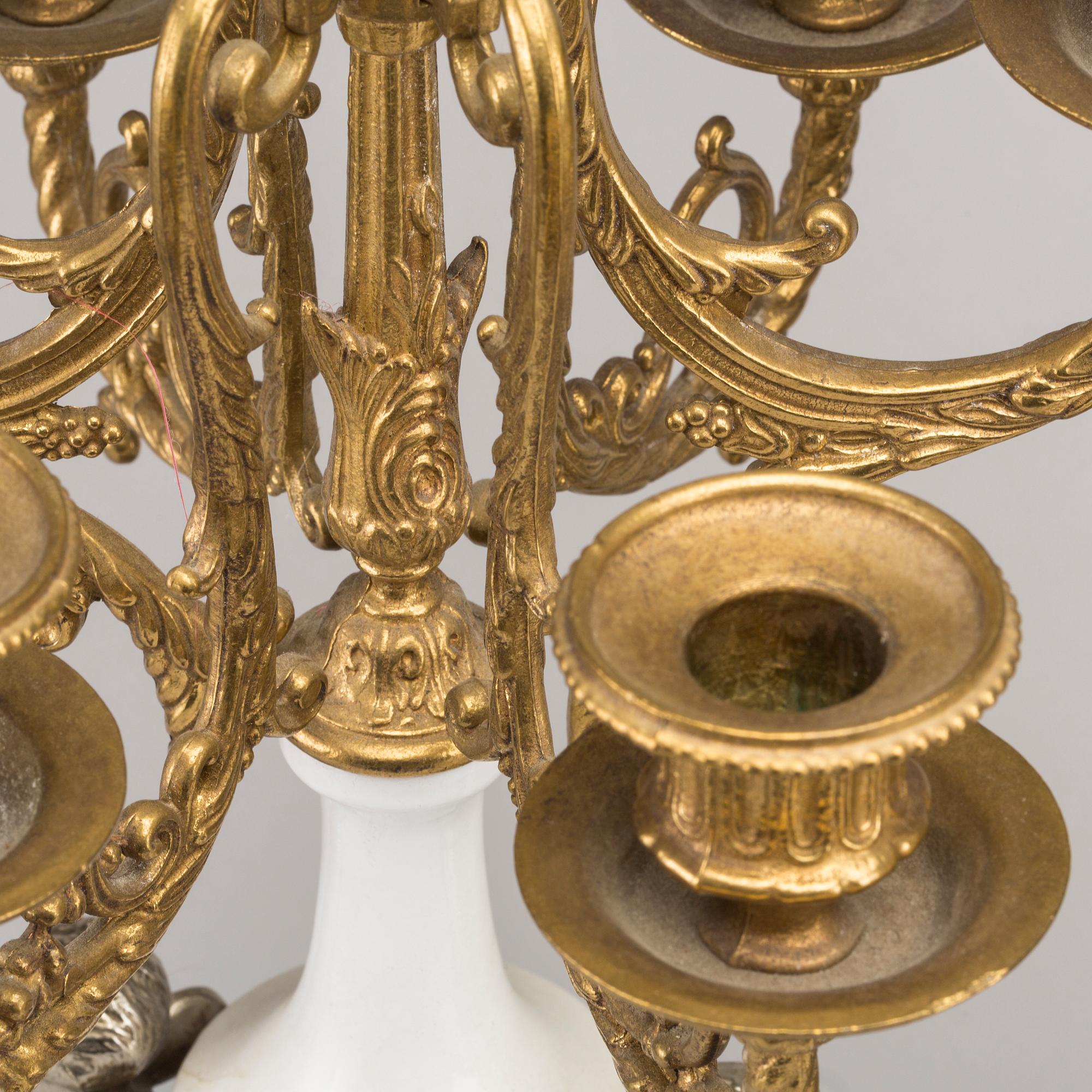 A LOUIS XVI STYLE GILT-BRASS CLOCK GRANITURE. Italy, SECOND HALF OF 20TH CENTURY.