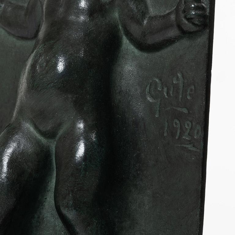 Axel Gute, a pair of patinated bronze bookends, dated 1920.