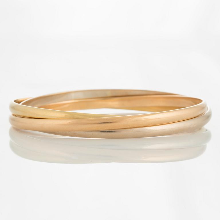 A Cartier "Trinity" bangle.