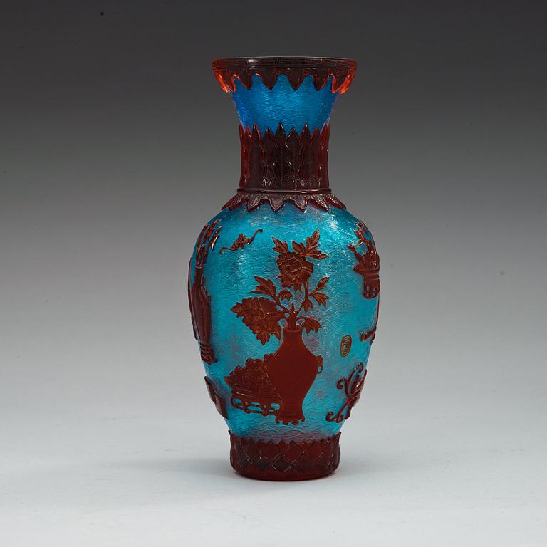A Chinese red, blue and gold splashed Peking glass vase, 20th Century.
