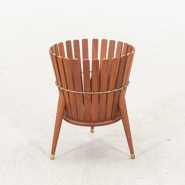 A 1950s teak wastepaper basket.