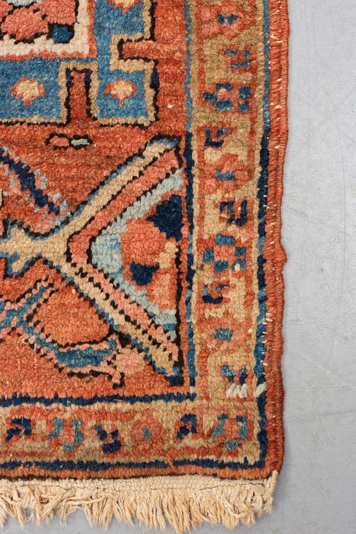 A carpet, antique Heriz, ca 334 x 271-276 cm ( ca 1-4 cm flat weave at the ends).