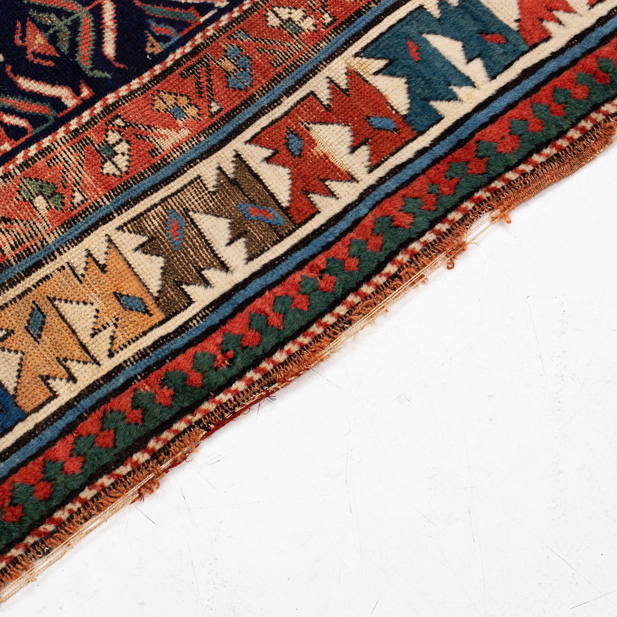 A antique Kazak gallery carpet, ca 310 x 105 cm.