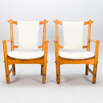 LASSE OLLINKARI, a pair of 1948 open armchairs.