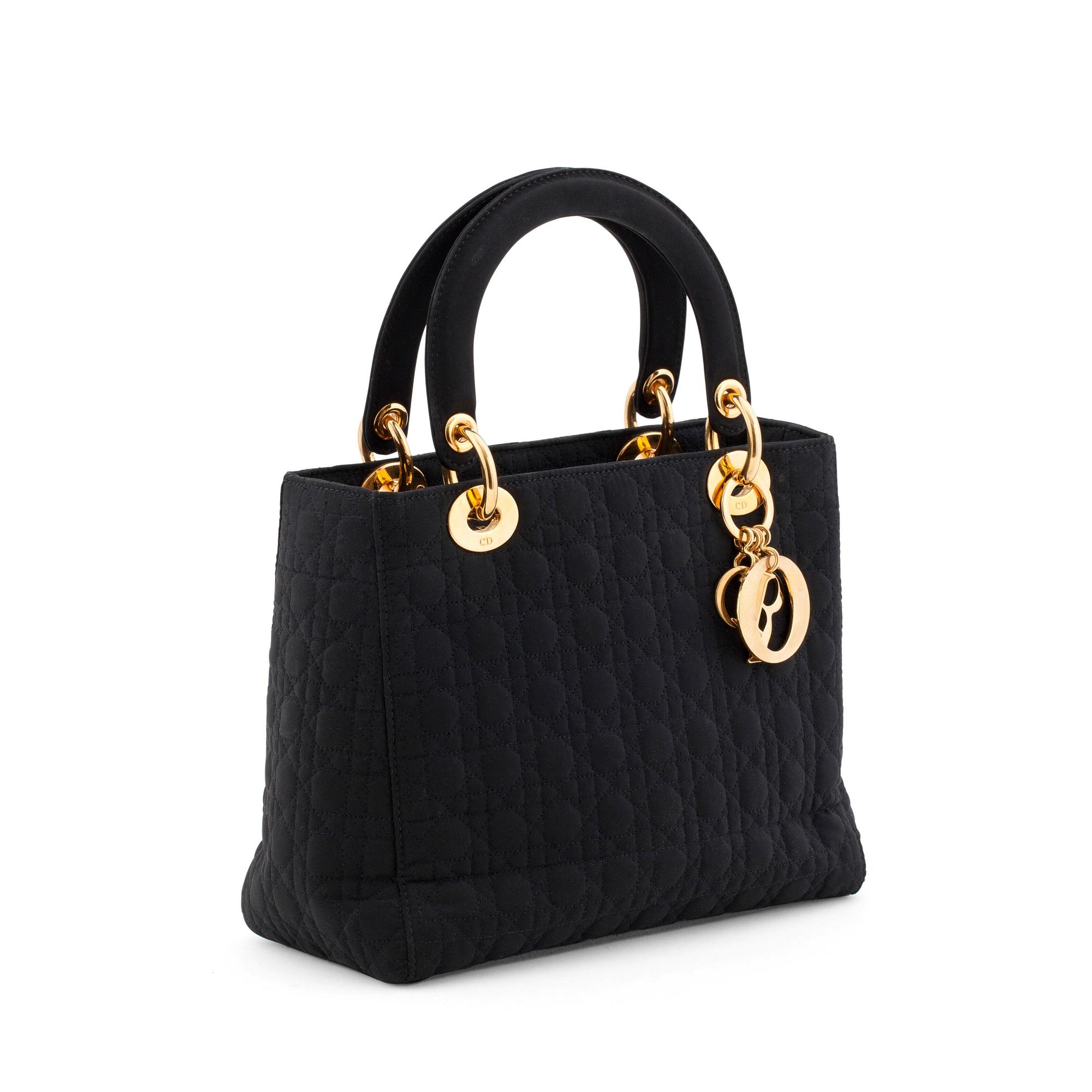 CHRISTIAN DIOR, a black silk blend handbag, "Lady Dior".