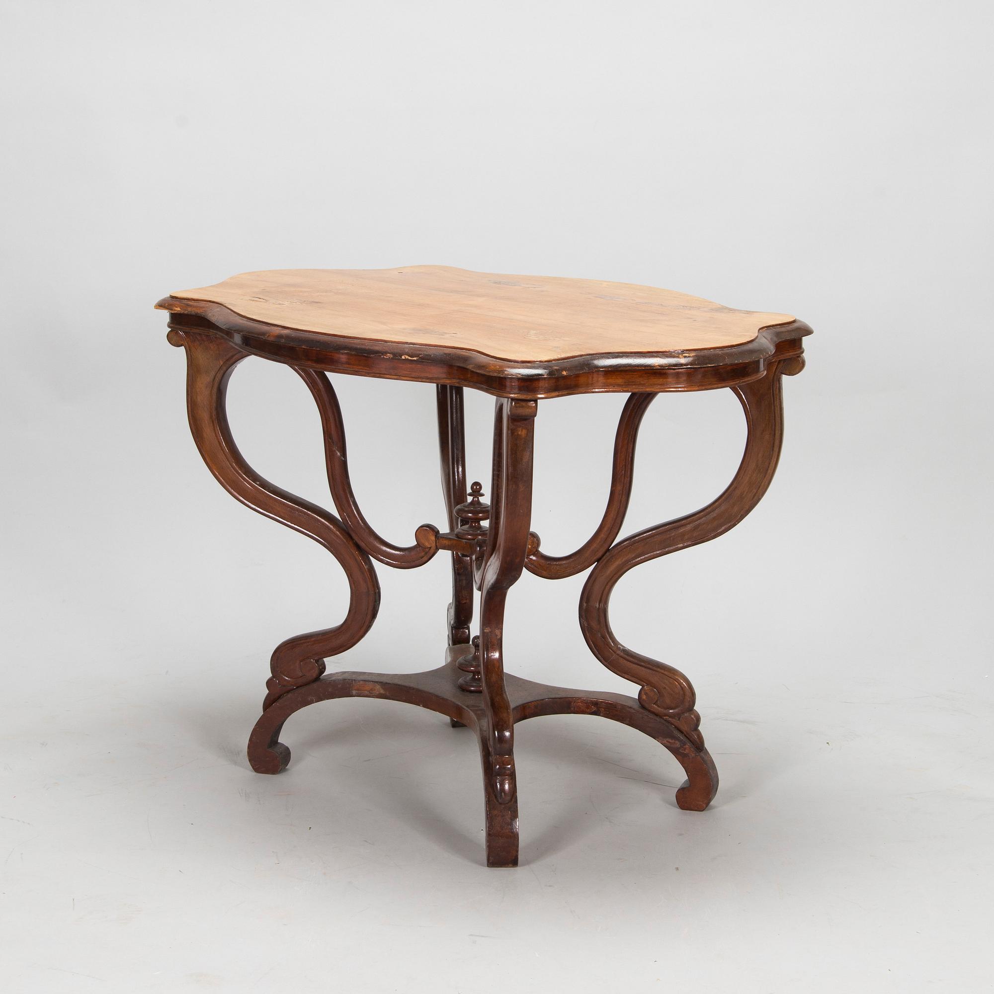 A pair of Russian armchairs and a table, late 19th century.