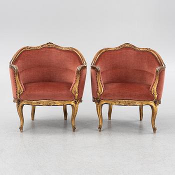A pair of rococo style armchairs, around 1900.