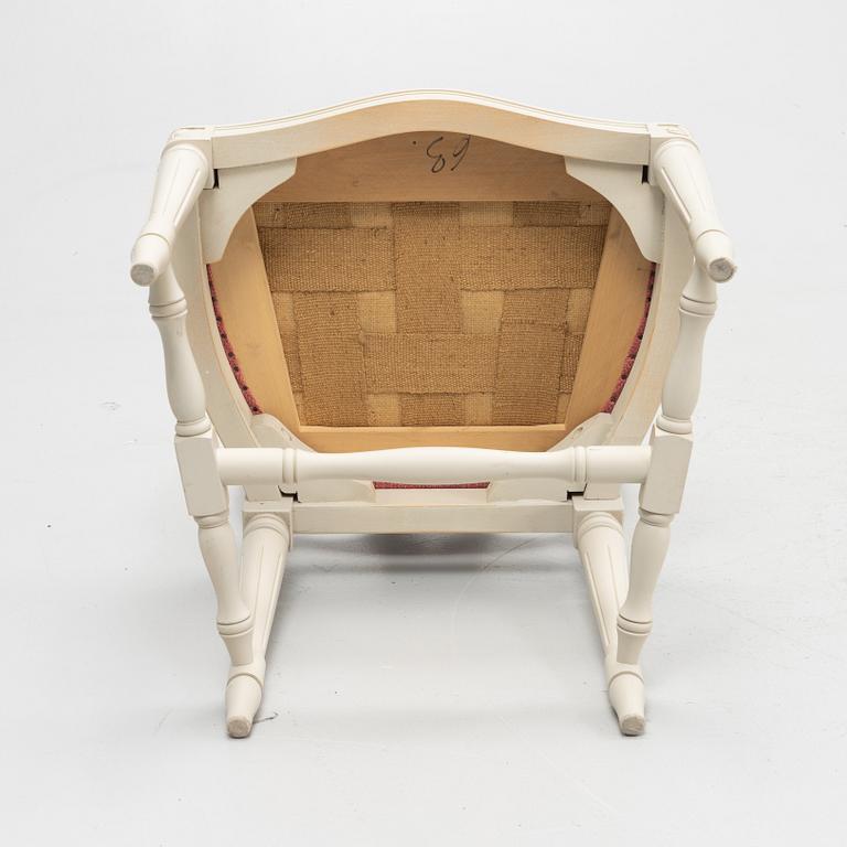 A Gustavian style table with four chairs, second half of the 20th century.