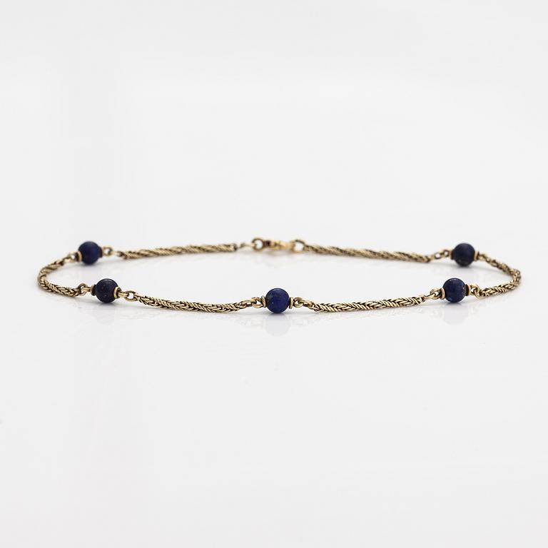 Rannekoru, 14K kultaa ja lapis lazuli.