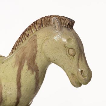 A set of two green and yellow glazed roof tiles figures of flying horses, Qing dynasty.