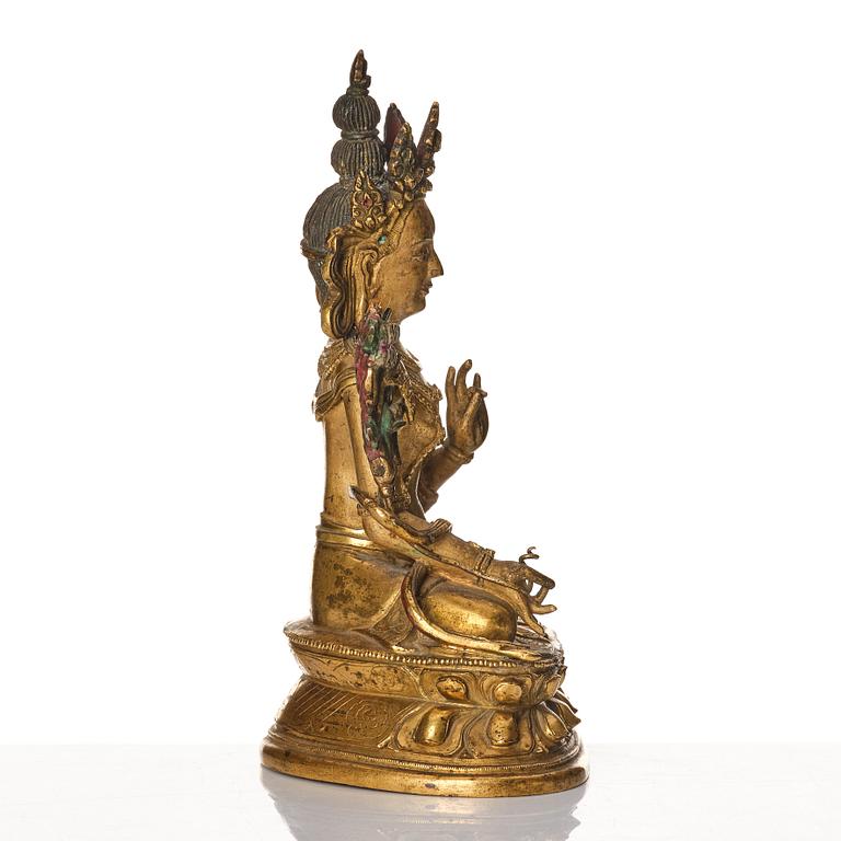 A Tibeto-Chinese/Mongolian gilt bronze figure of White Tara, 18th Century.