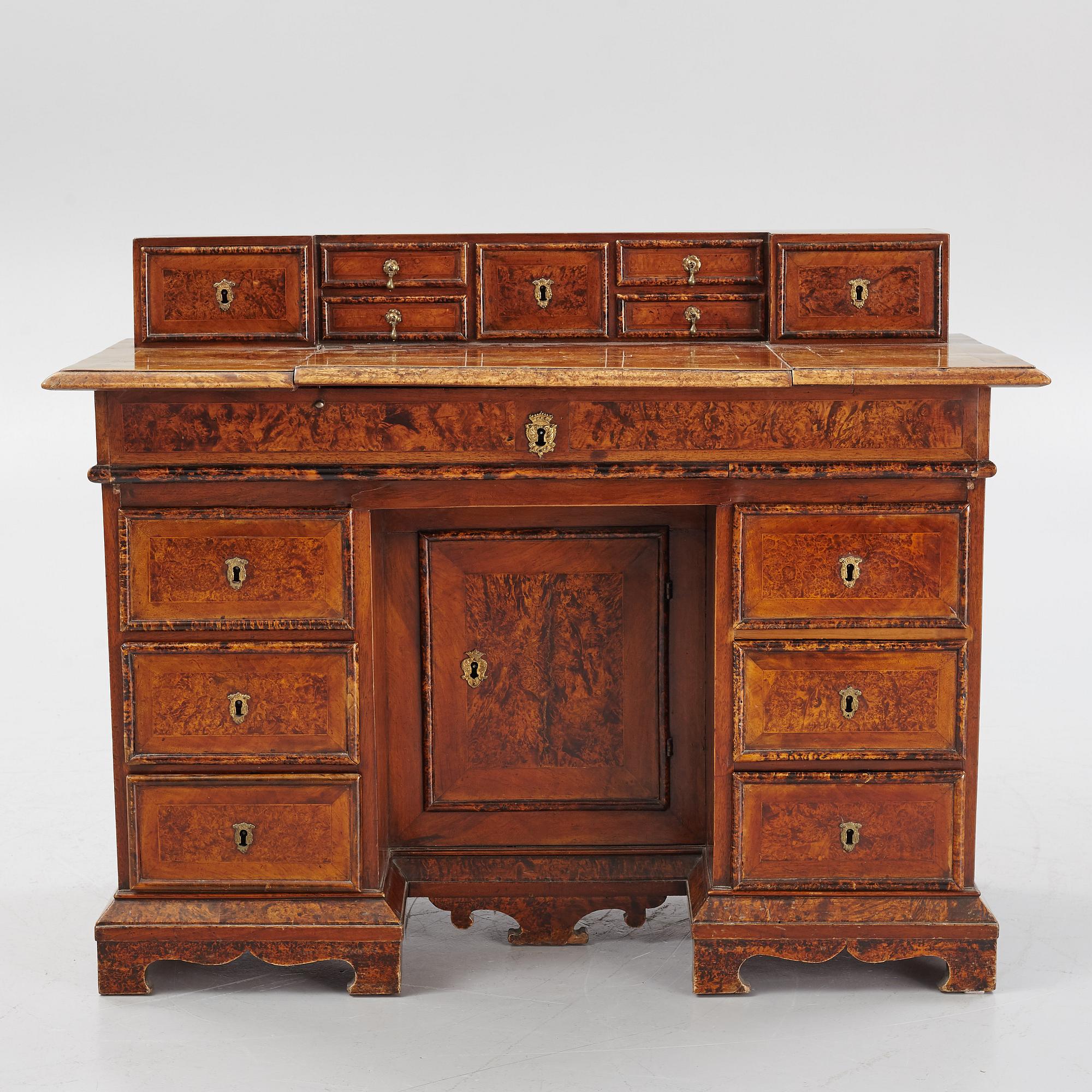 A Swedish late Baroque alder-veneered 'knee-hole' writing desk, first part of the 18th century.