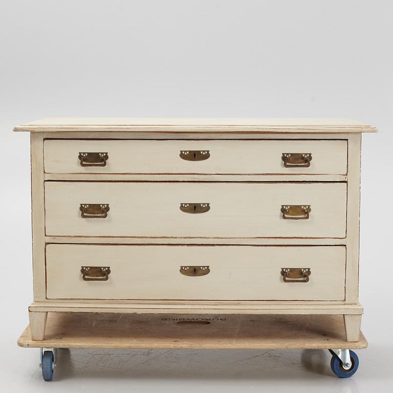 A chest of drawers, circa 1900.