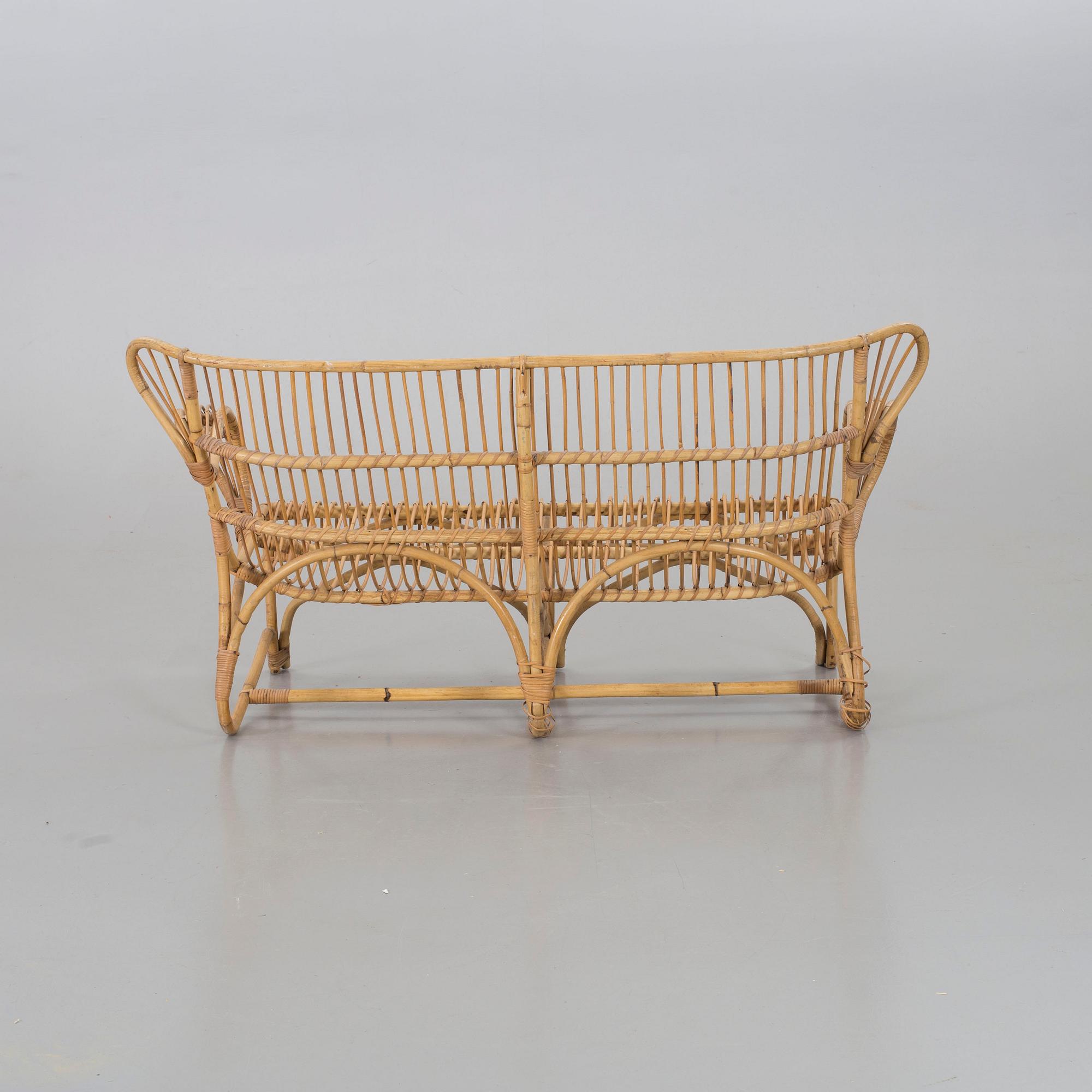 A mid 20th century ratten couch.