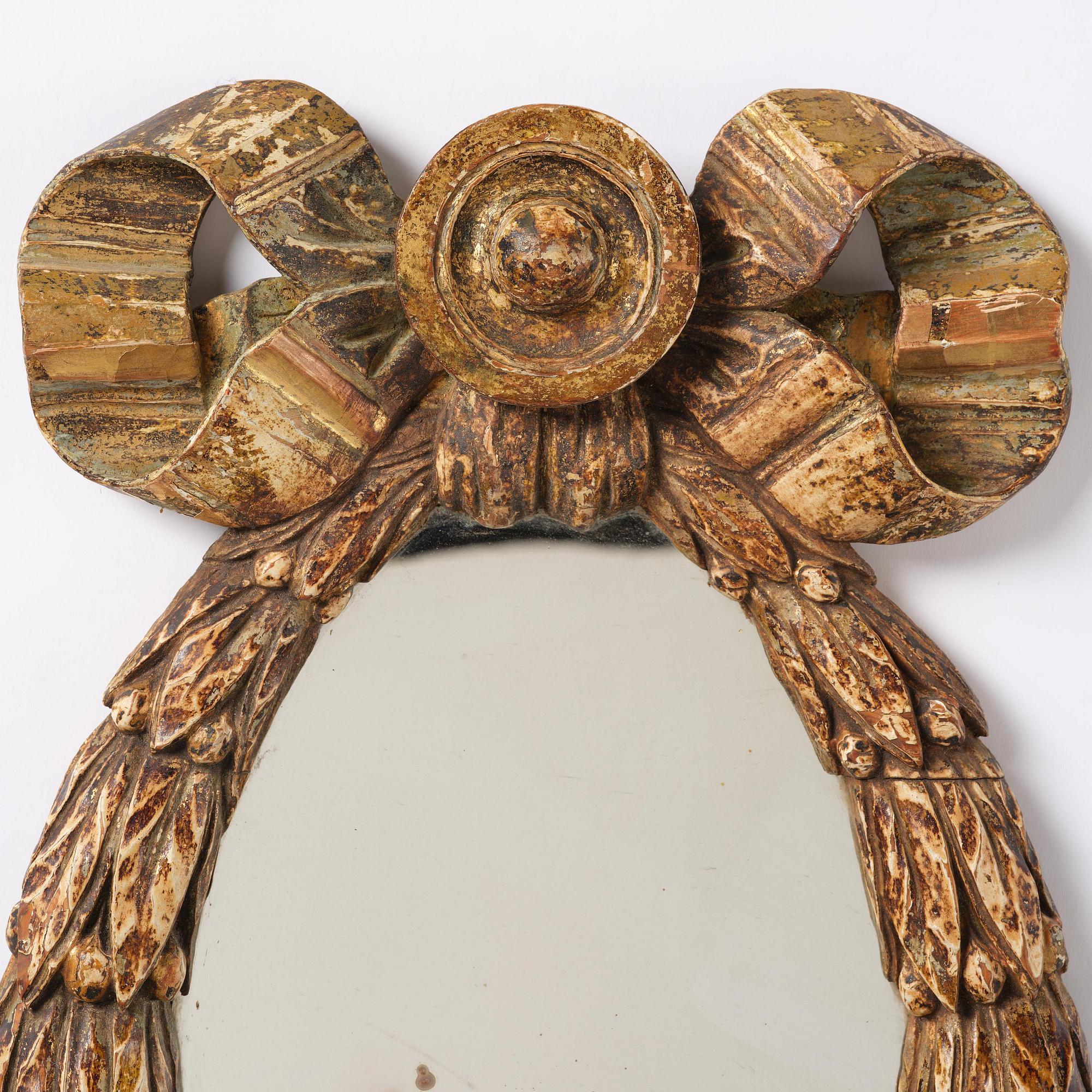 A Gustavian giltwood mirror, late 18th century.