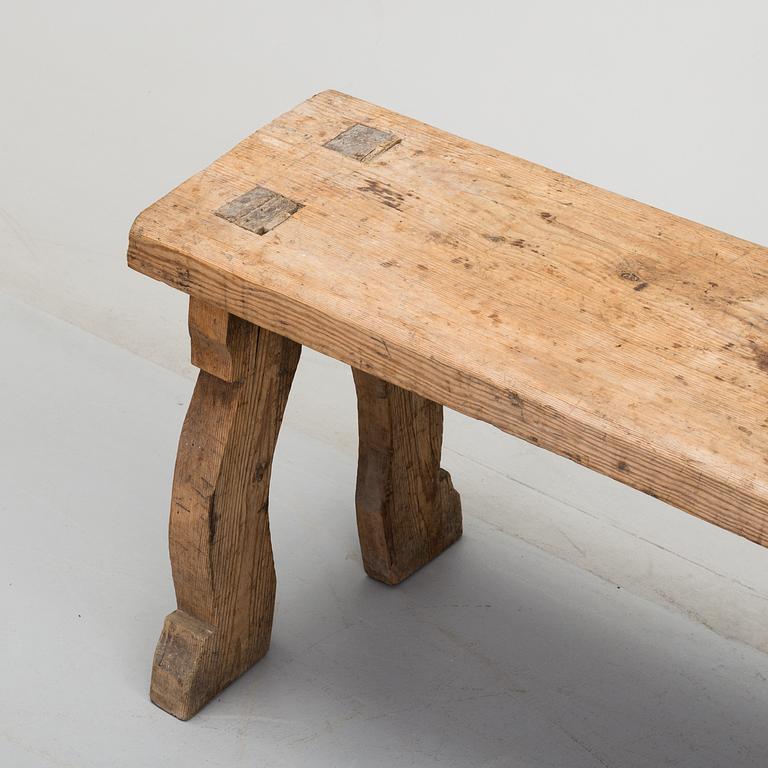 A 19th century folk art bench.