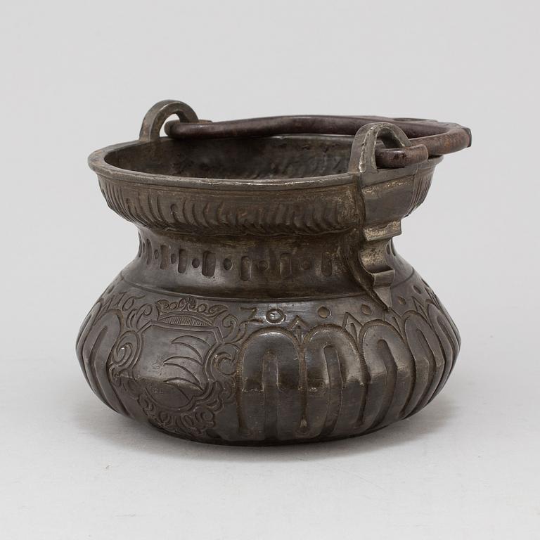 A holy water bowl dated 1620.