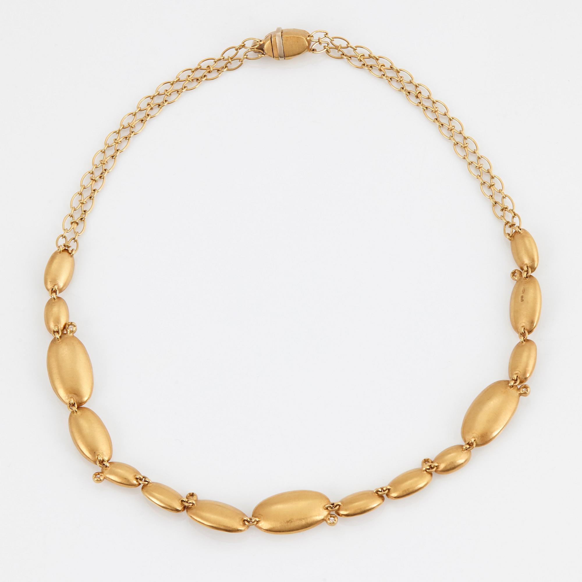 Collier Stern "Justine" 18K guld med cabochonslipad bergkristall och runda briljantslipade diamanter.