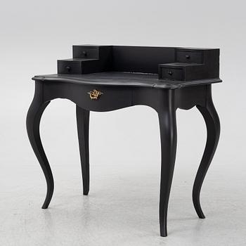 A painted rococo style writing desk, from around the year 1900.