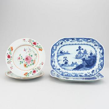 A set of two blue and white serving dishes, and two famille rose dinner plates, Qing dynasty, Qianlong (1736-95).