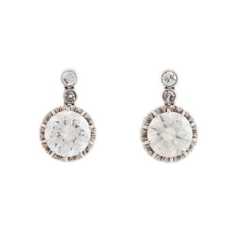 409. A pair of platinum earrings set with round brilliant- and old-cut diamonds.